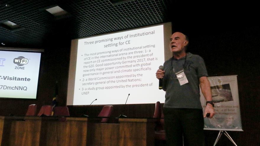 Man speaking in front of a presentation