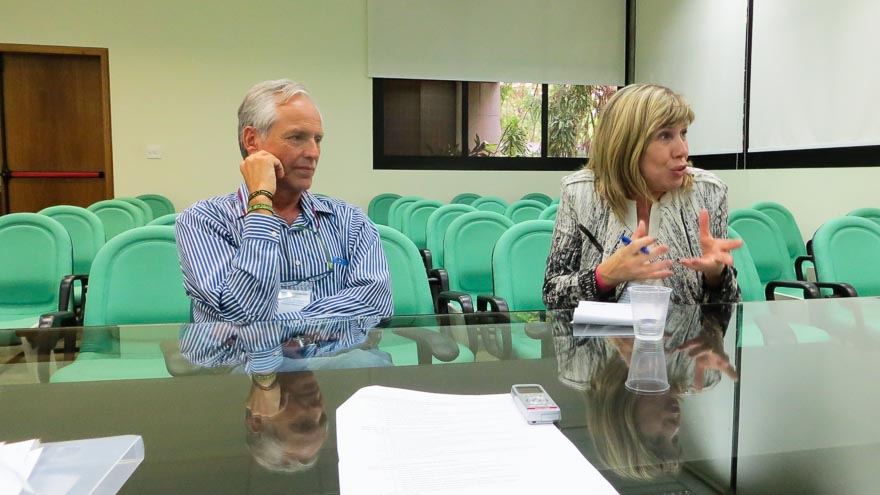 Two people speaking at a table