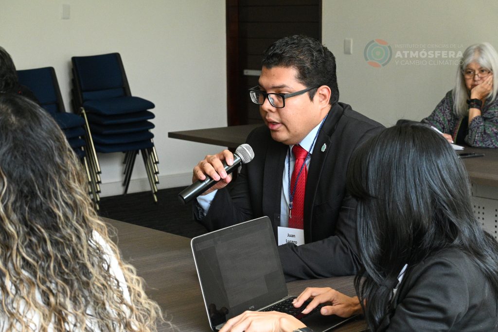 Man speaking into a microphone during one of the workshop's sessions